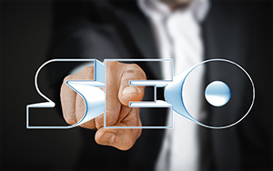 Ocean County SEO in 3D text in front of person in a suit pointing a finger forwards