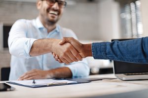 Hand shake between ATM vendors in NJ and a branch manager