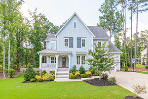 Home with trees cared for by Smithville tree service experts who keep the property safe from risk.