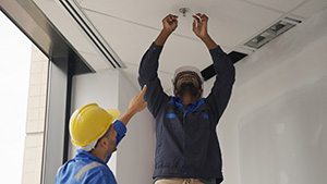 Engineers performing NJ fire alarm installation